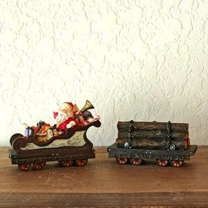 1998 2 Piece Resin Santa with Toys in Sleigh and Pile of Wood Logs Train